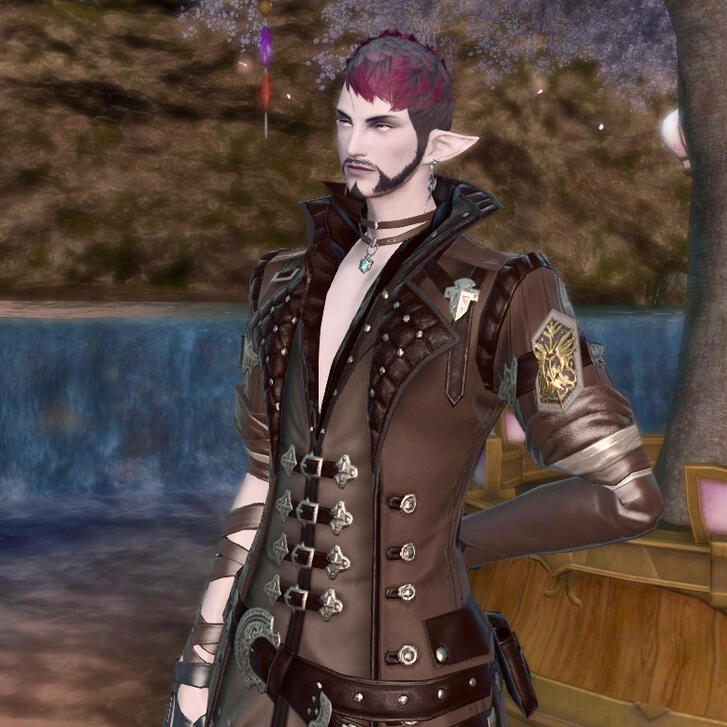 Remi the duskwight elezen wears a long leather coat, a deeply open-collared shirt and a fair amount of jewelry. He has inky hair tipped with scarlet and bright silver eyes.